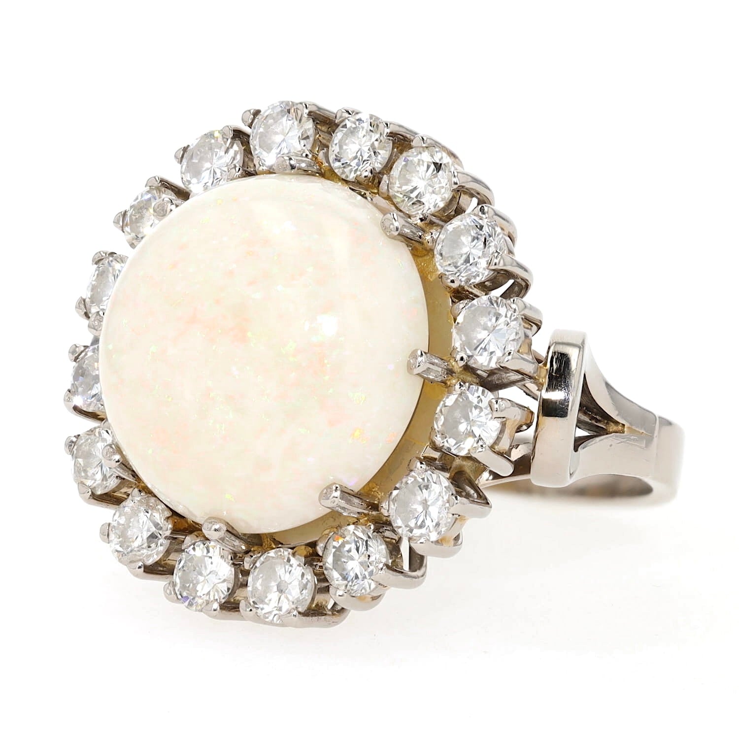 Cocktail ring in 585 white gold with a large opal cabochon and approx. 1.28 ct brilliants, turned horizontally to the left