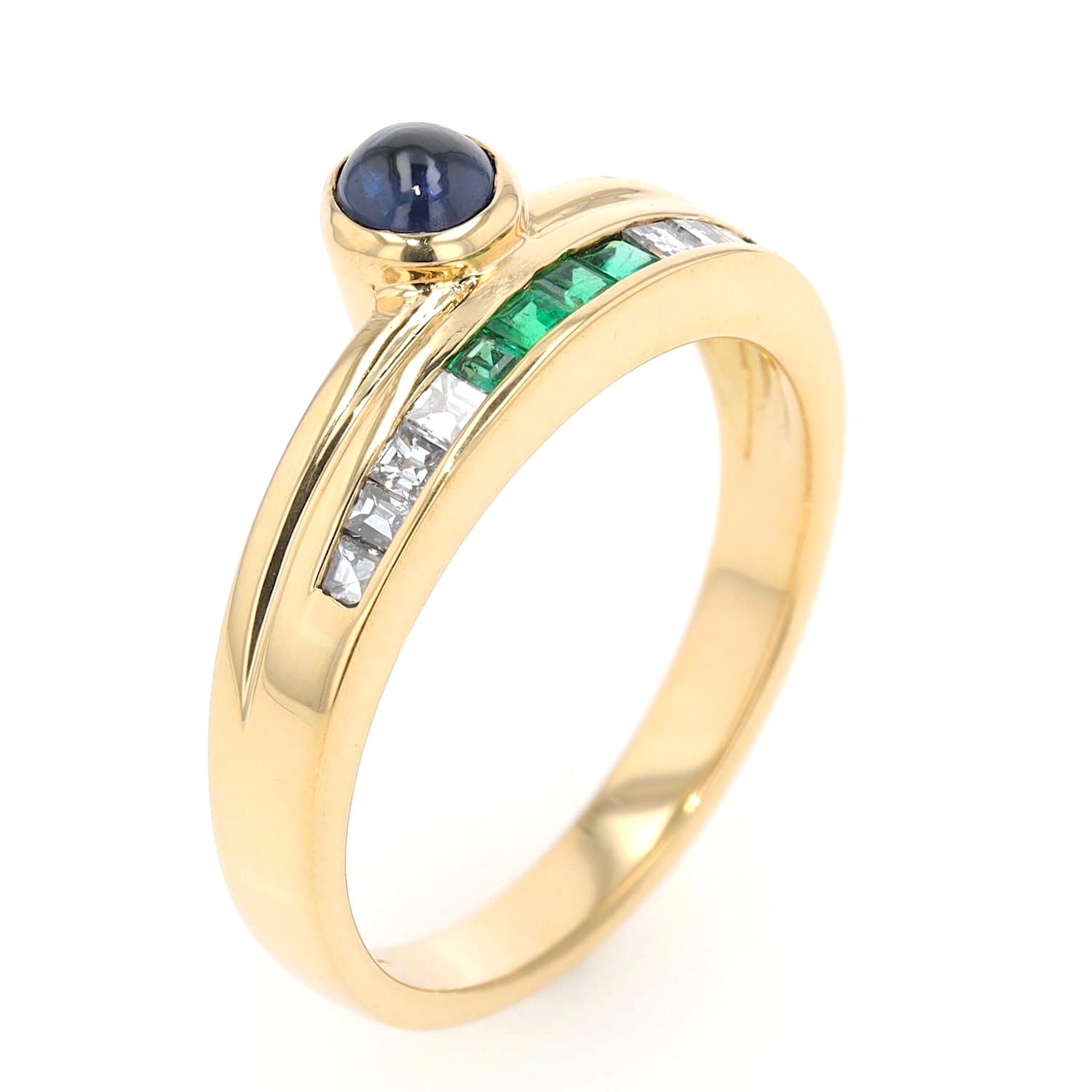 Buchwald ring in 750 yellow gold with diamonds, emeralds and a sapphire cabochon, standing