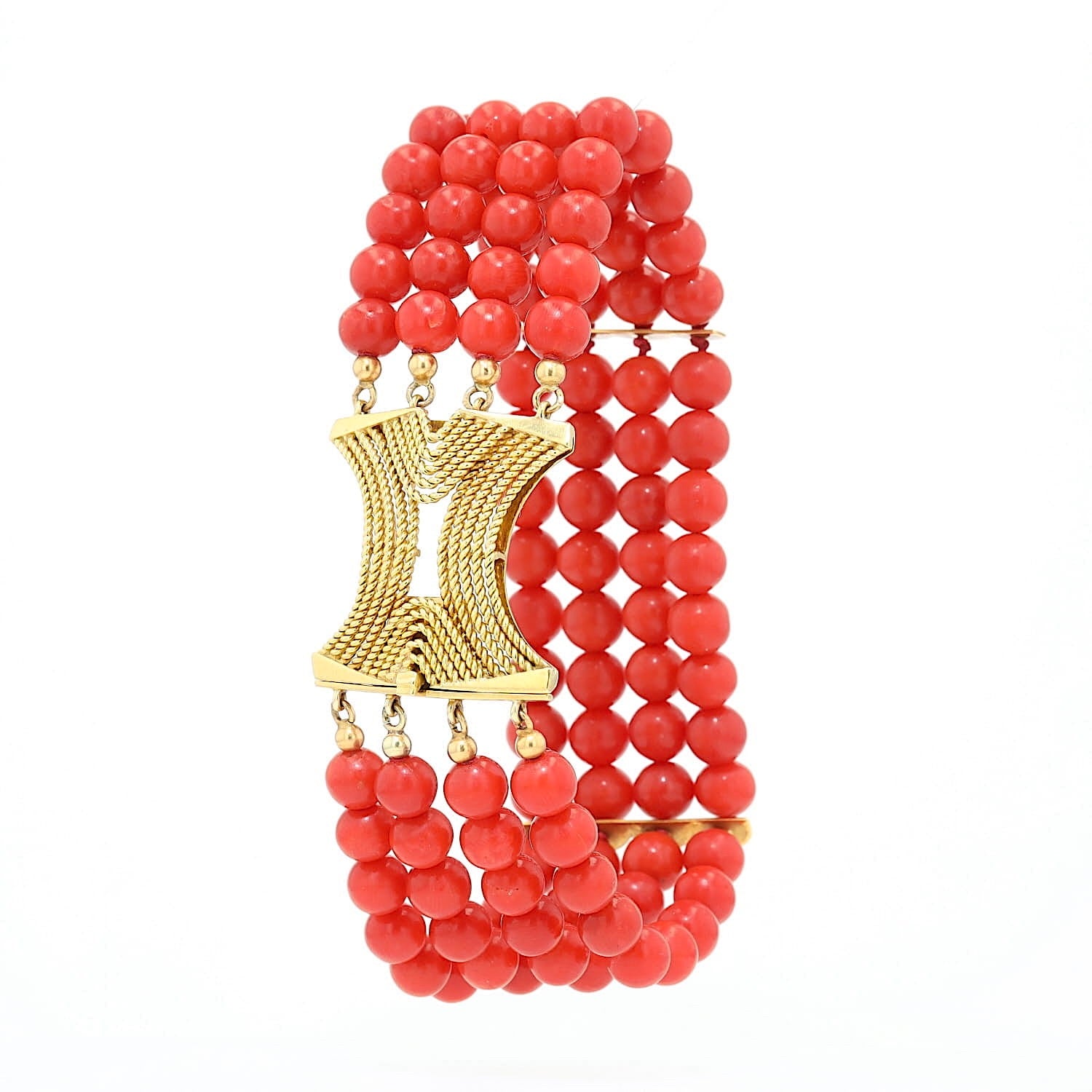 Four-row vintage red coral bracelet with a 750 yellow gold clasp, turned to the left