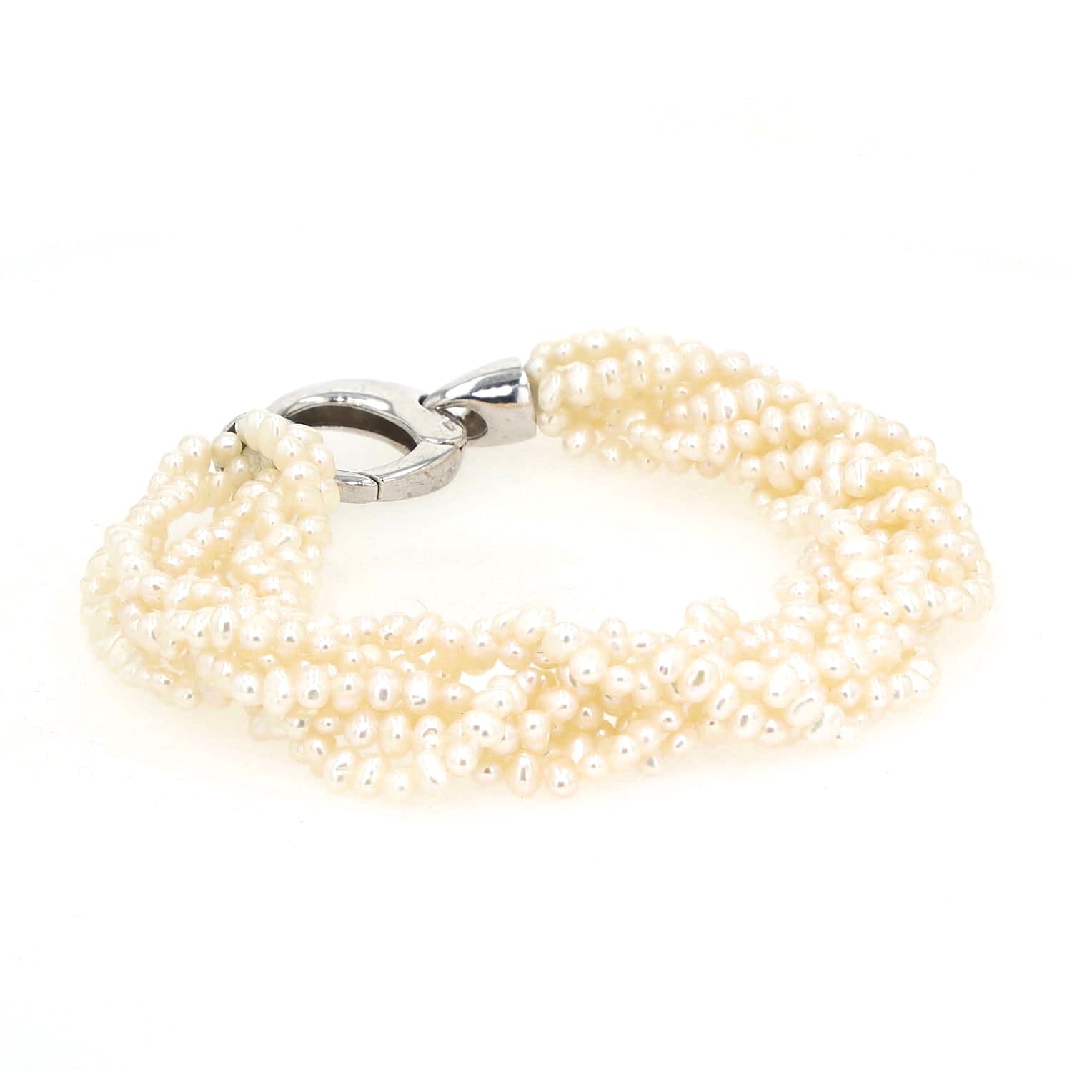 Bracelet with 8 intertwined rows of cultured pearls and a silver lock, horizontal lock turned to the left at the back