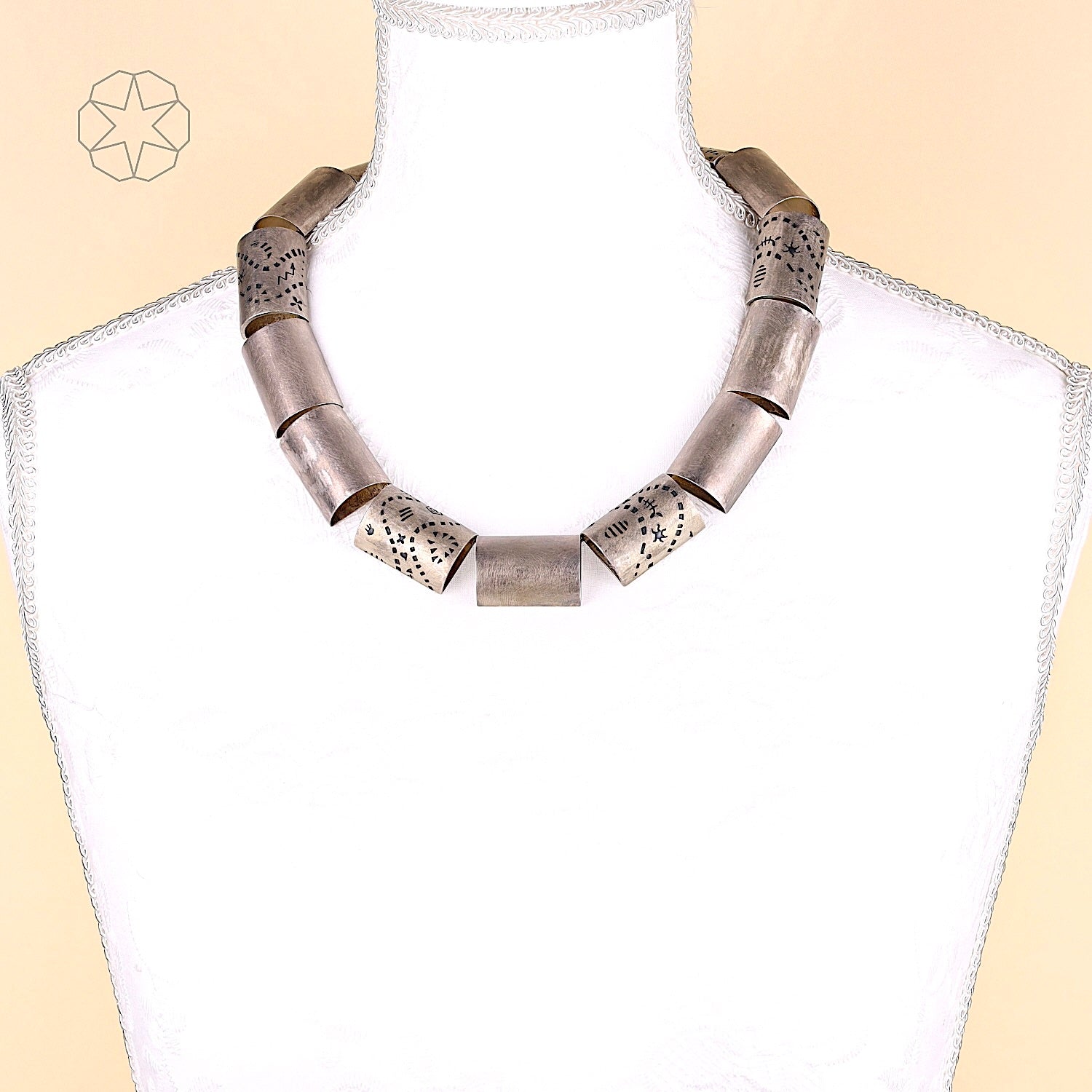 Designer silver necklace, on the bust