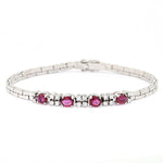 Bracelet in 750 white gold with brilliants and rubies, lying frontally