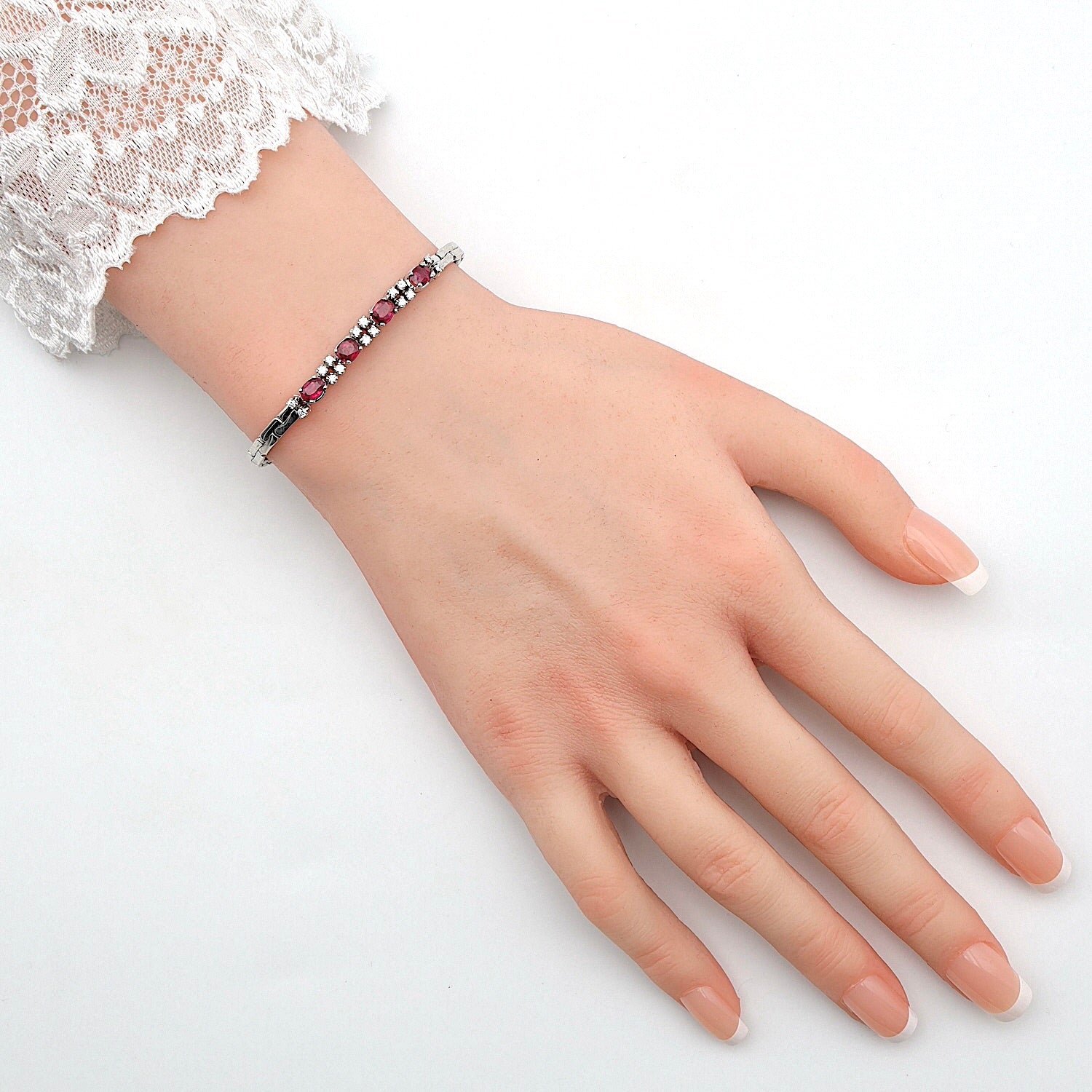 Bracelet in 750 white gold with brilliants and rubies, on the arm