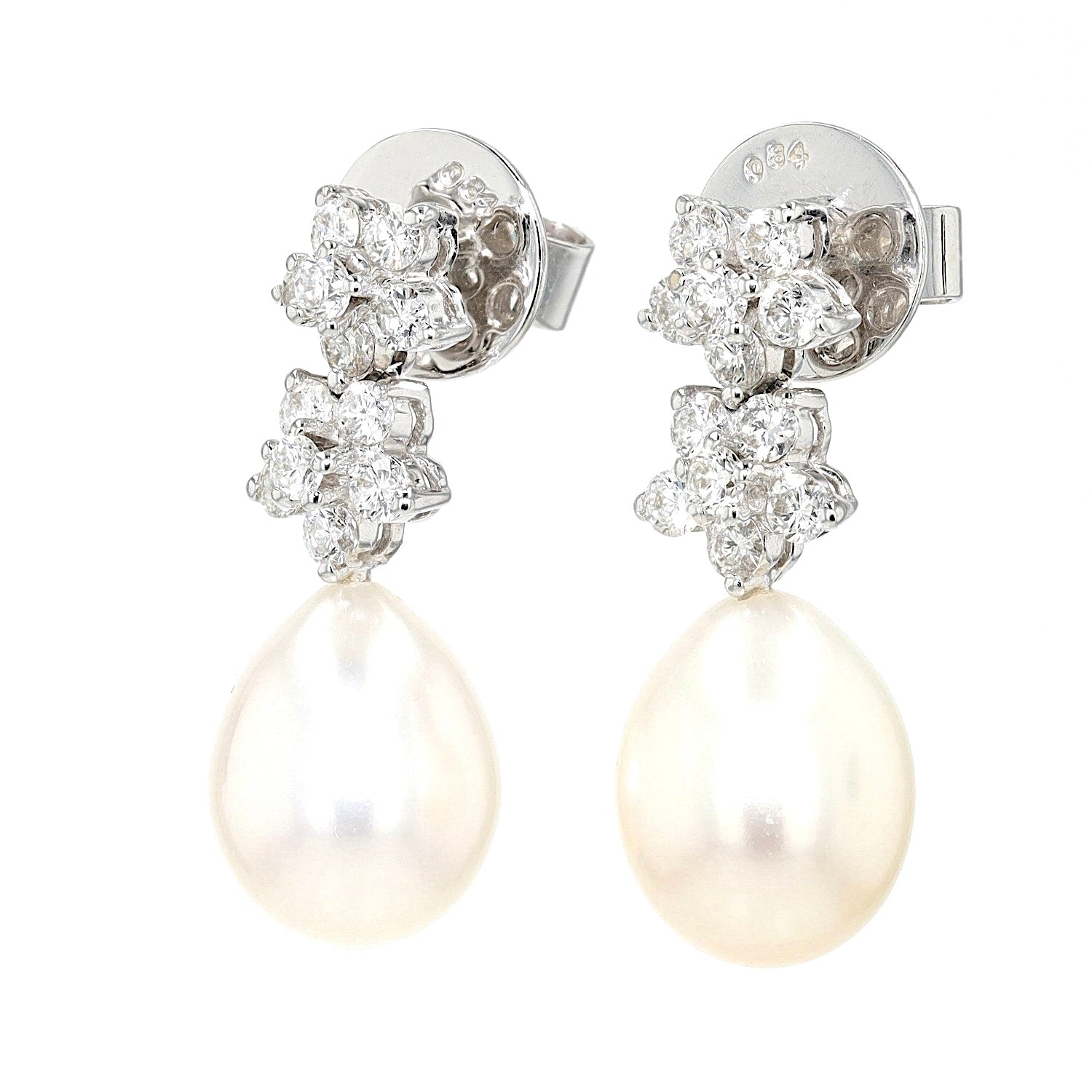 Earrings in 750 white gold with cultured pearls and brilliants, hanging left twisted