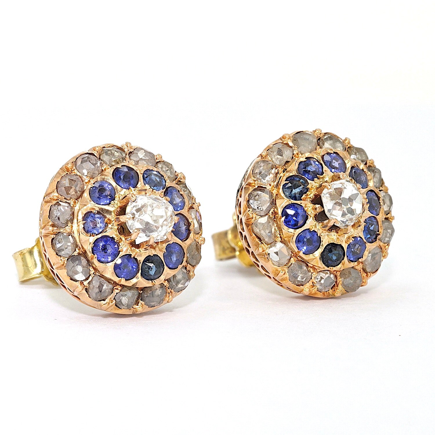 Victorian stud earrings in 750 rose gold with diamonds and sapphires, turned horizontally to the right