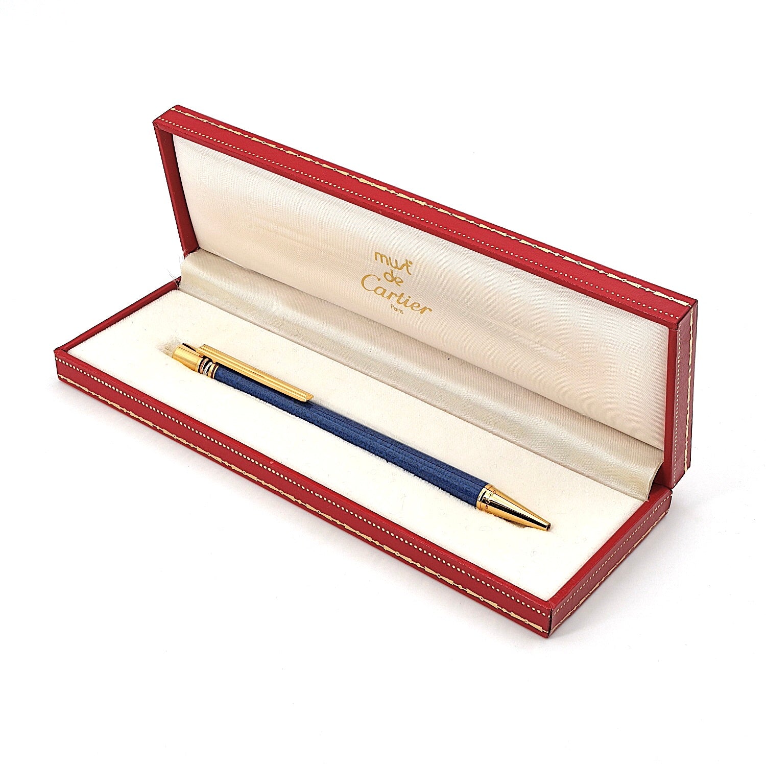 Ballpoint pen with twist mechanism by Cartier, Must de Cartier Trinity, lying in box