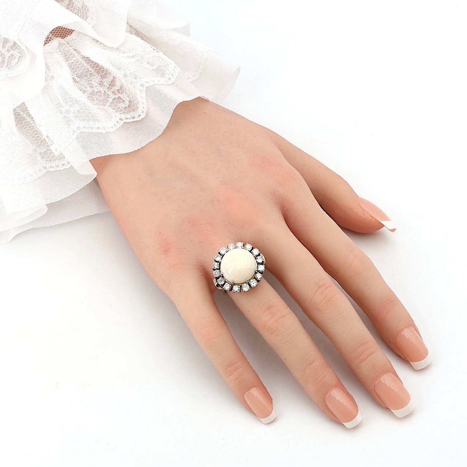 Cocktail ring in 585 white gold with a large opal cabochon and approx. 1.28 ct brilliants, on the hand