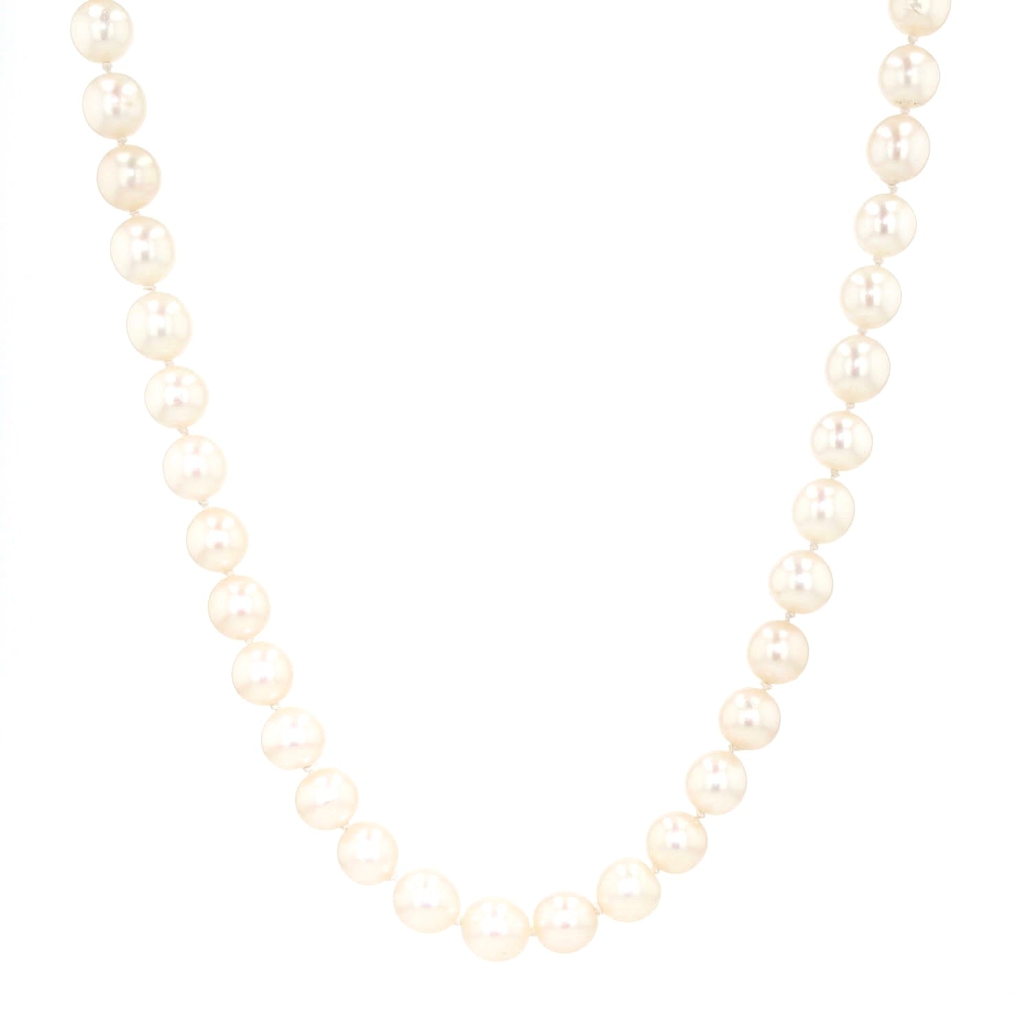 Akoya cultured pearl necklace with a 585 white gold clasp with diamonds and emeralds, hanging left twisted