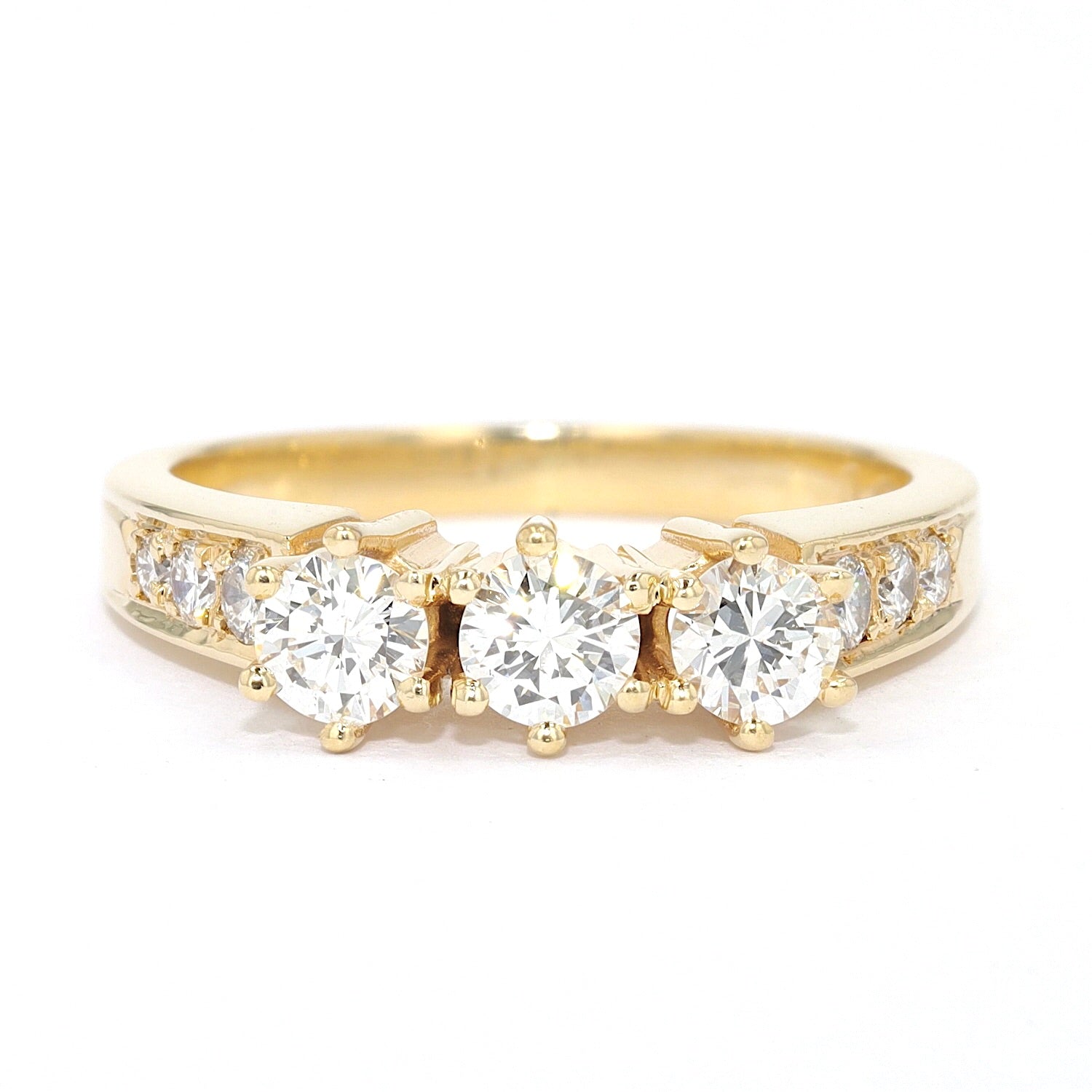 3-stone engagement ring in 585 yellow gold with approx. 0.66 ct brilliants, lying frontal