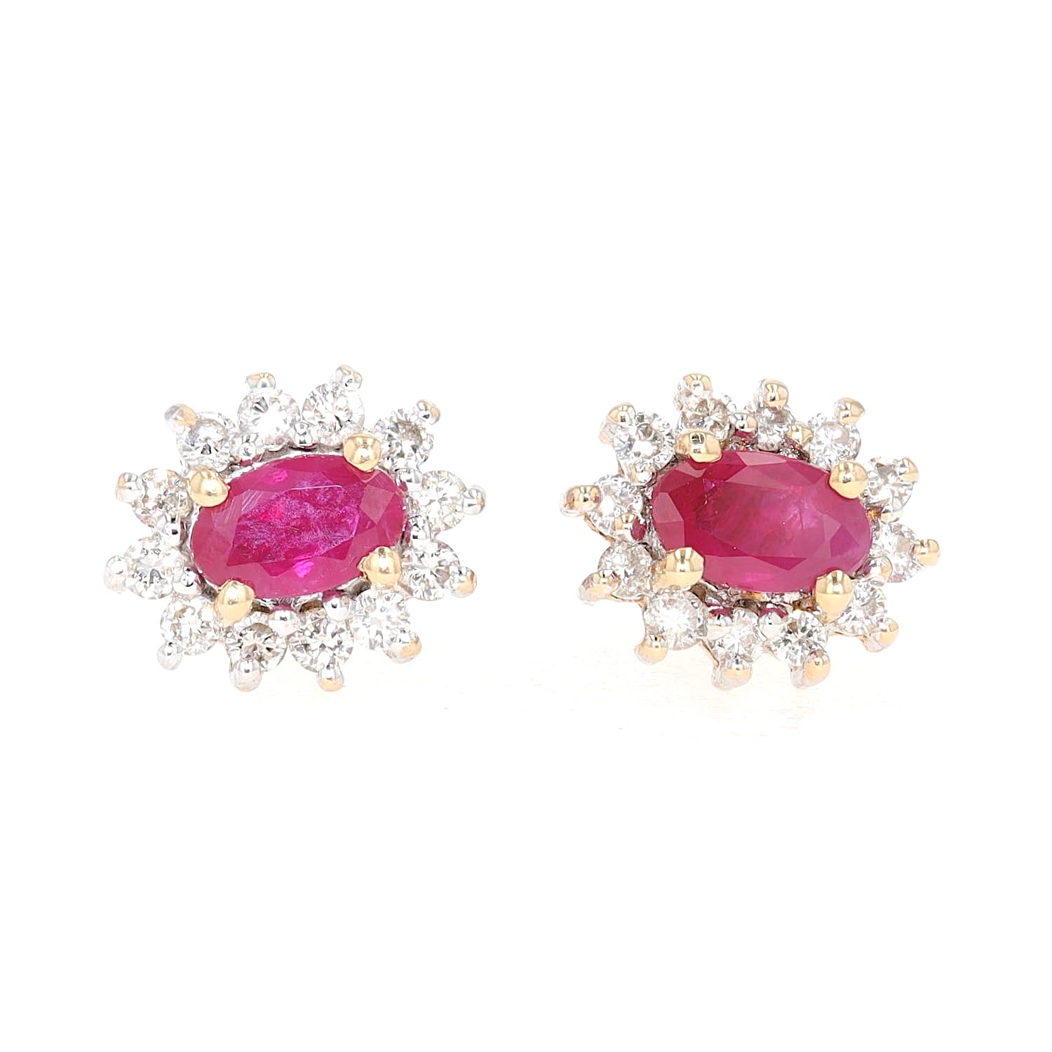 1 pair of stud earrings in 585 bicolor gold with brilliants and rubies, lying frontally