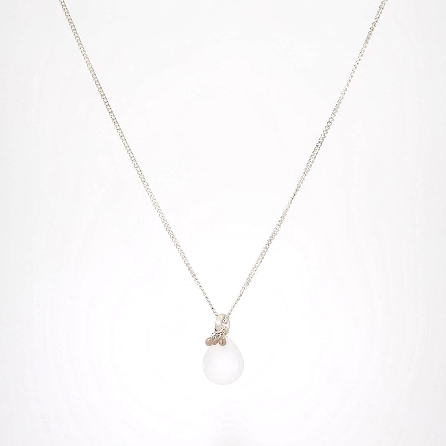 Necklace with pendant in 835 silver with a frosted rock crystal in drop shape and small diamonds, hanging frontally