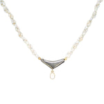 River pearl necklace with a lock made of 925 silver and 750 yellow gold and a pendant with a moonstone, hanging frontally