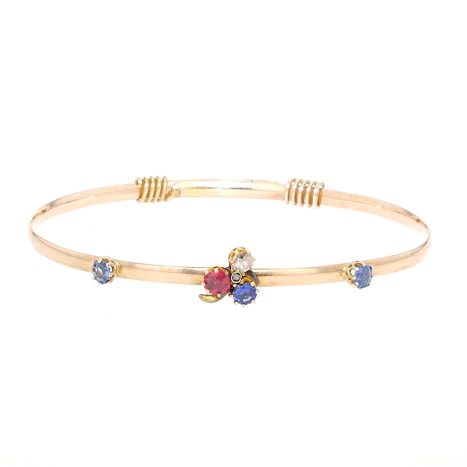 Vintage bangle in 585 rose gold with diamonds, a red spinel and sapphires, on the arm