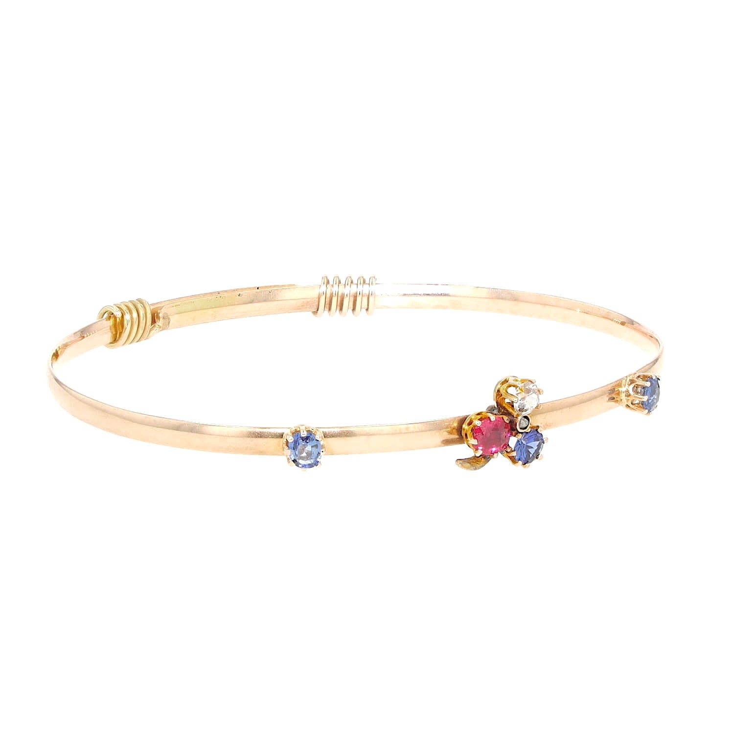 Art Nouveau bangle in 585 rose gold with diamonds, a red spinel and sapphires, turned horizontally to the right