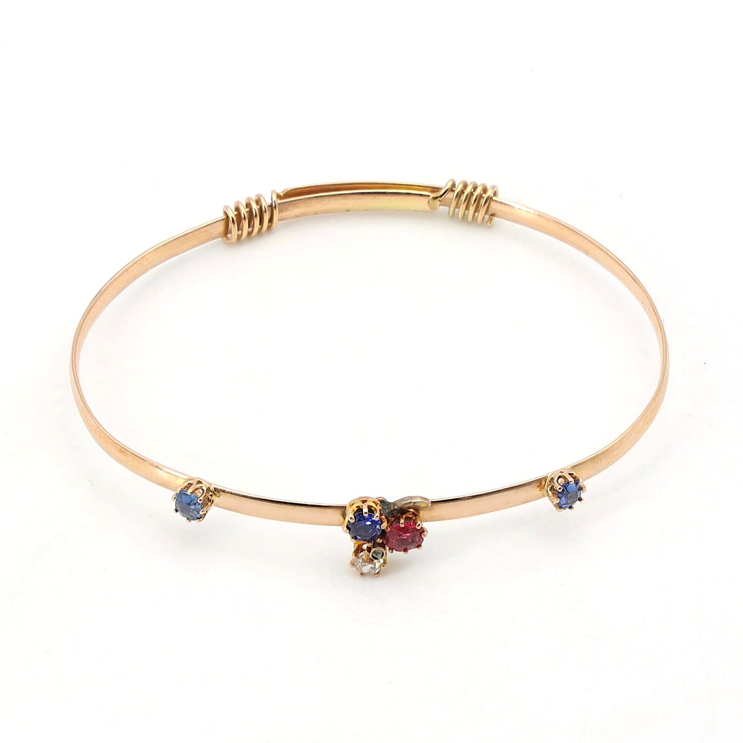 Art Nouveau bangle in 585 rose gold with diamonds, a red spinel and sapphires, horizontal top view