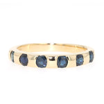 Ring in 585 yellow gold with blue sapphires, lying frontally