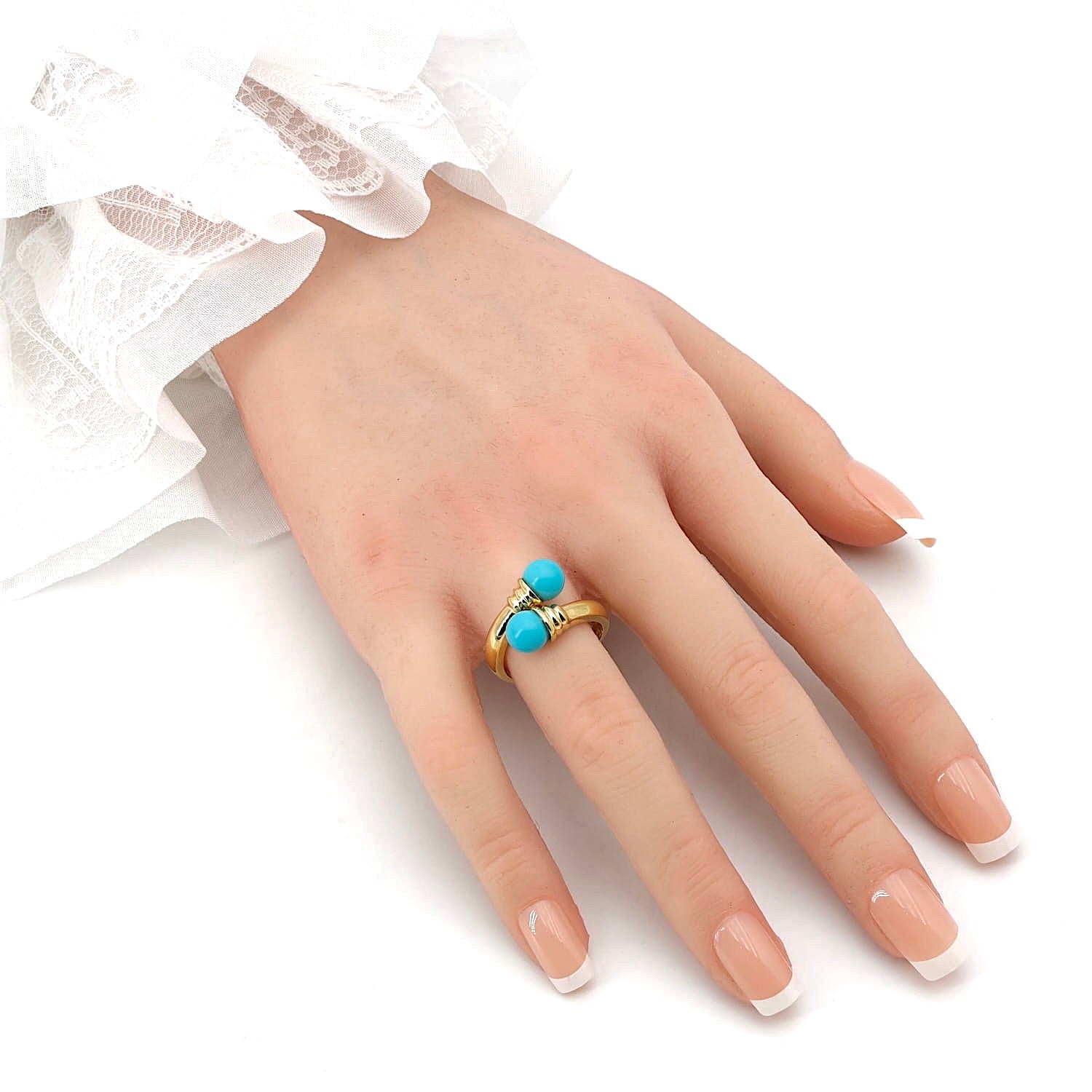 Ring in 585 yellow gold with two turquoise spheres, on the hand