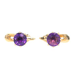 Tuxedo/frock buttons in 585 yellow gold, each with an amethyst, lying frontally