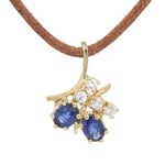 Pendant in 585 yellow gold with blue sapphires and brilliants, hanging frontally