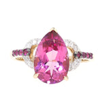 Ring in 375 yellow gold with a pink topaz, sapphires and brilliants, lying frontally