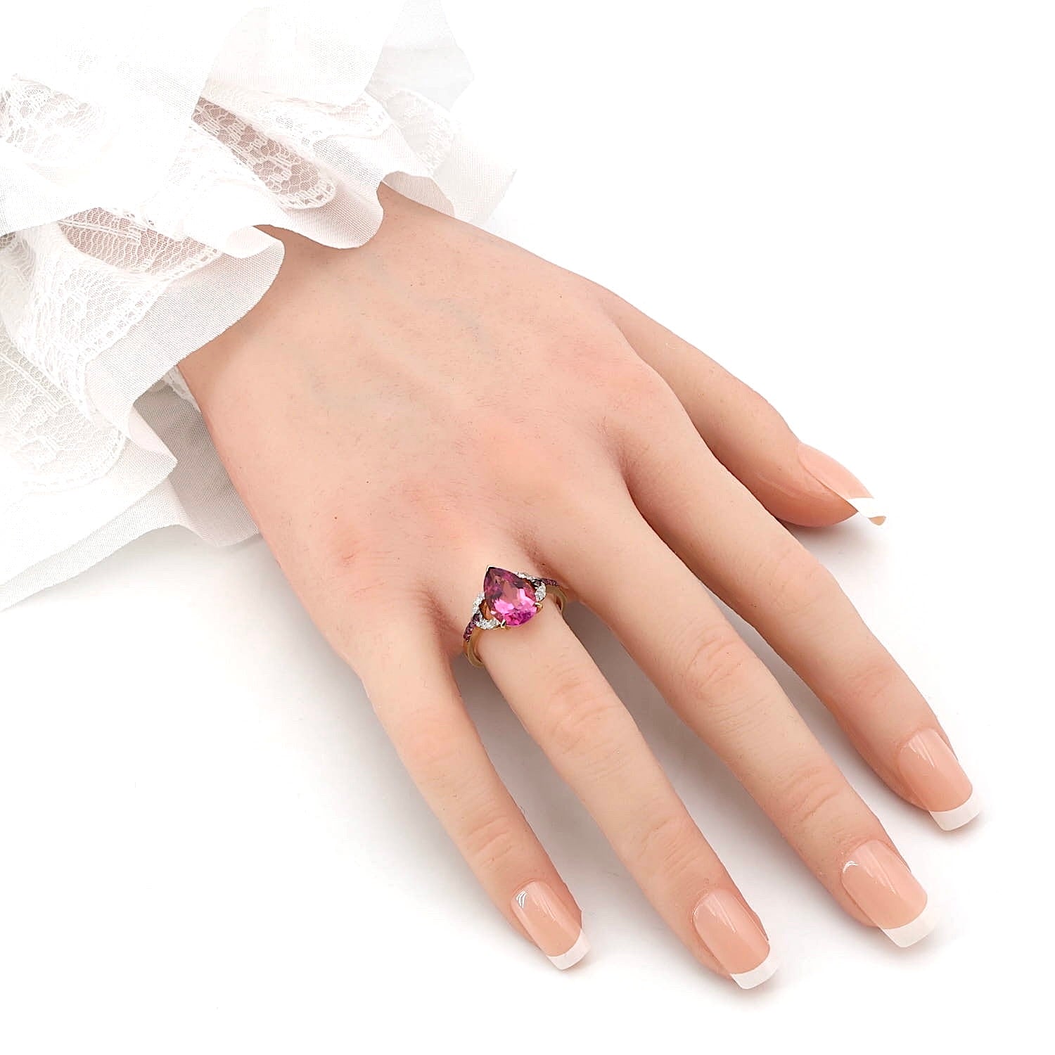 Ring in 375 yellow gold with a pink topaz, sapphires and brilliants, standing