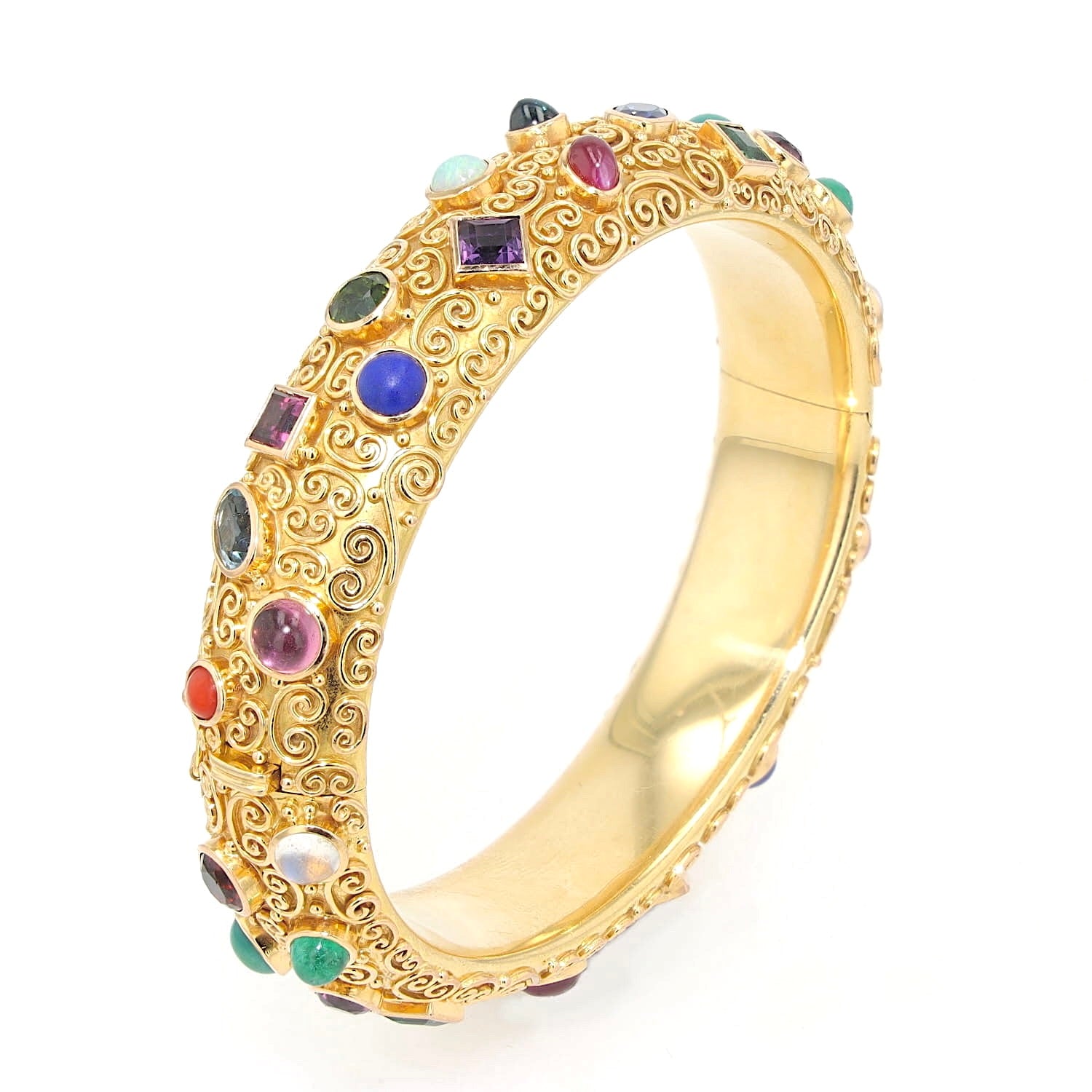 Bracelet by Eugen Hirner in 750 yellow gold with various colorful gemstones, standing