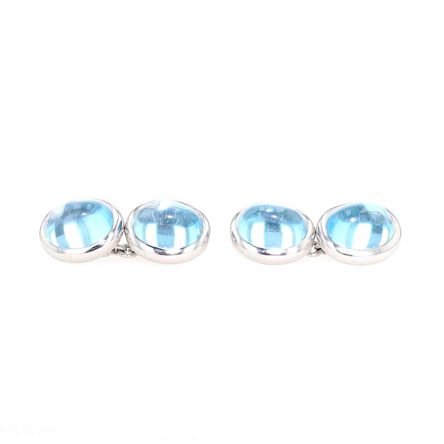 Cufflinks in 750 white gold with cabochon-cut blue topazes, lying frontally