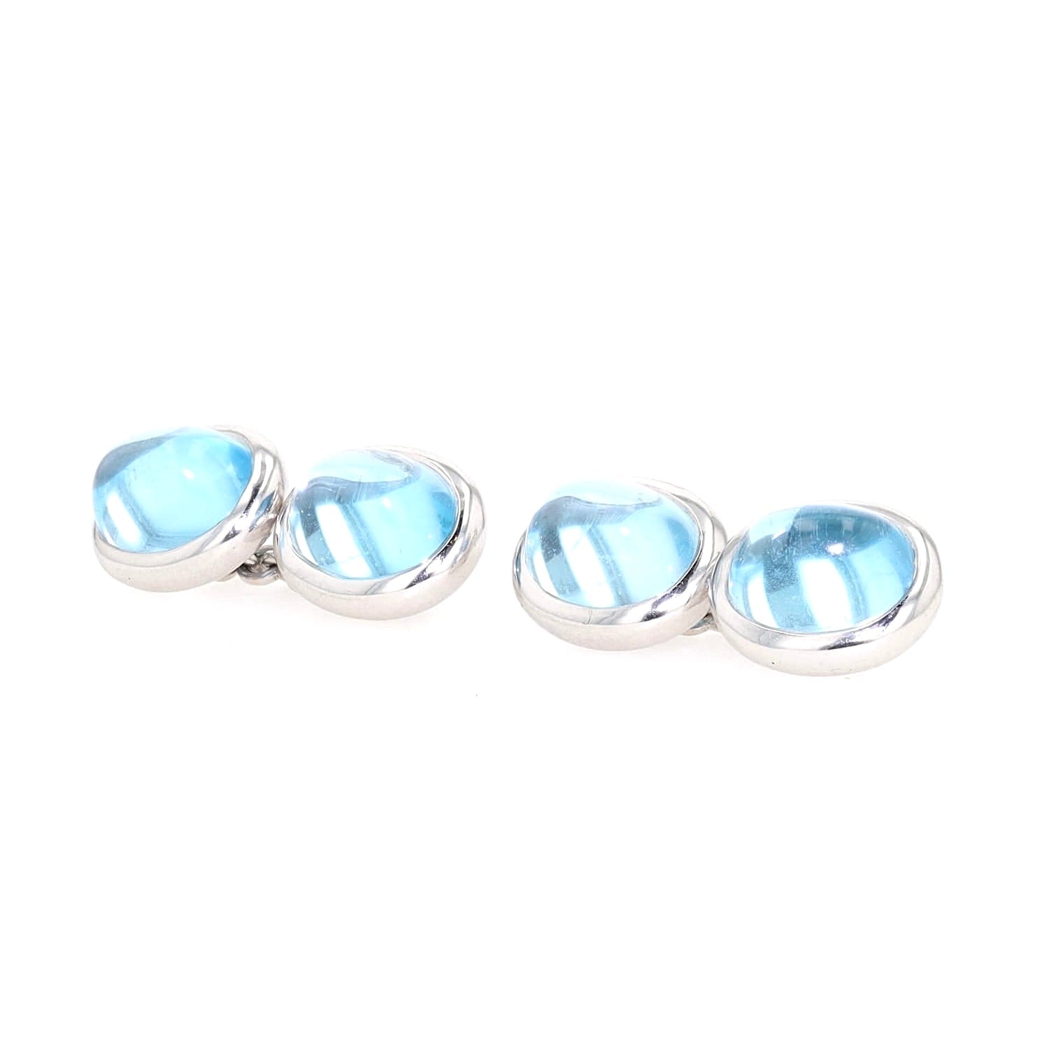 Cufflinks in 750 white gold with cabochon-cut blue topazes, turned horizontally to the left