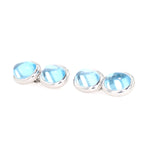 Cufflinks in 750 white gold with cabochon-cut blue topazes, turned horizontally to the left