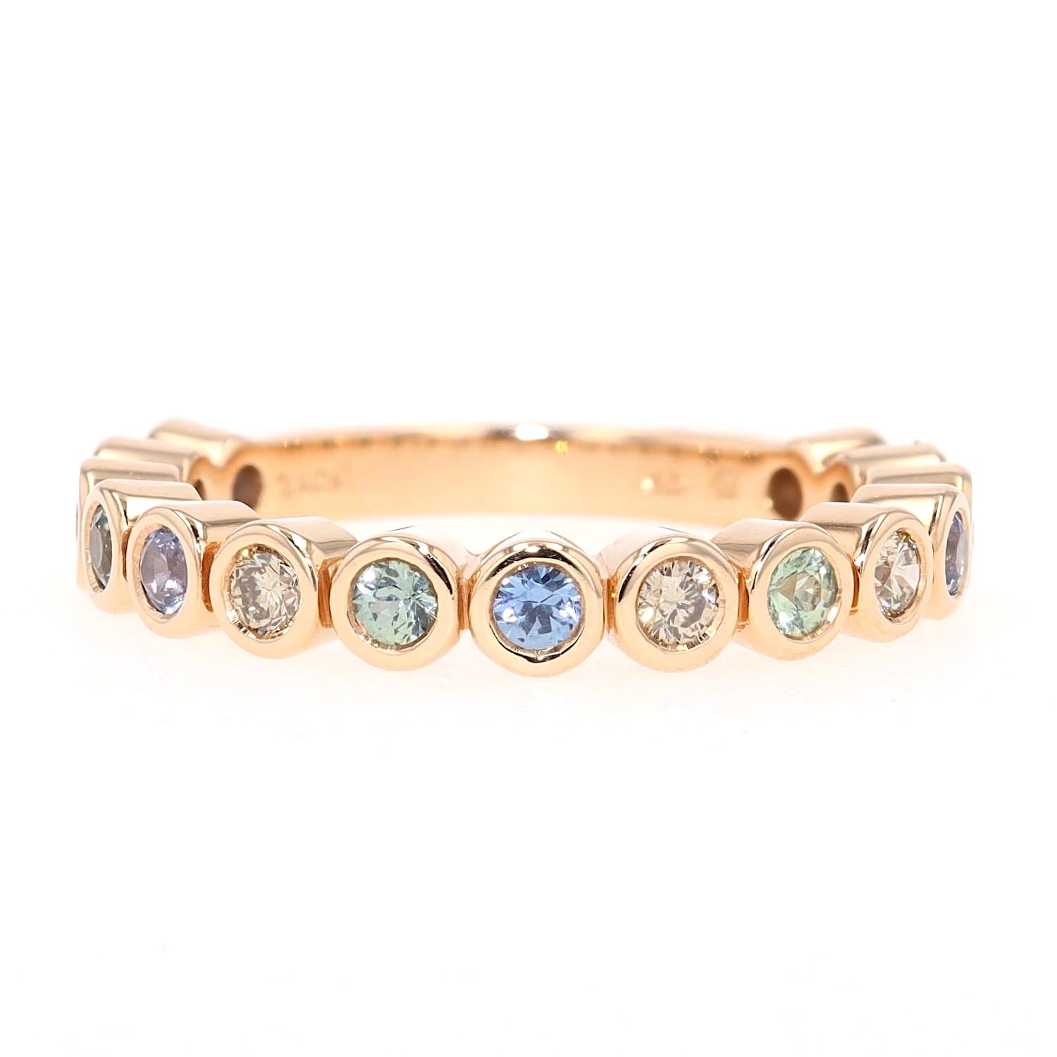 Bron Ring Confetti in 750 rose gold with colorful sapphires and brilliants, lying frontal