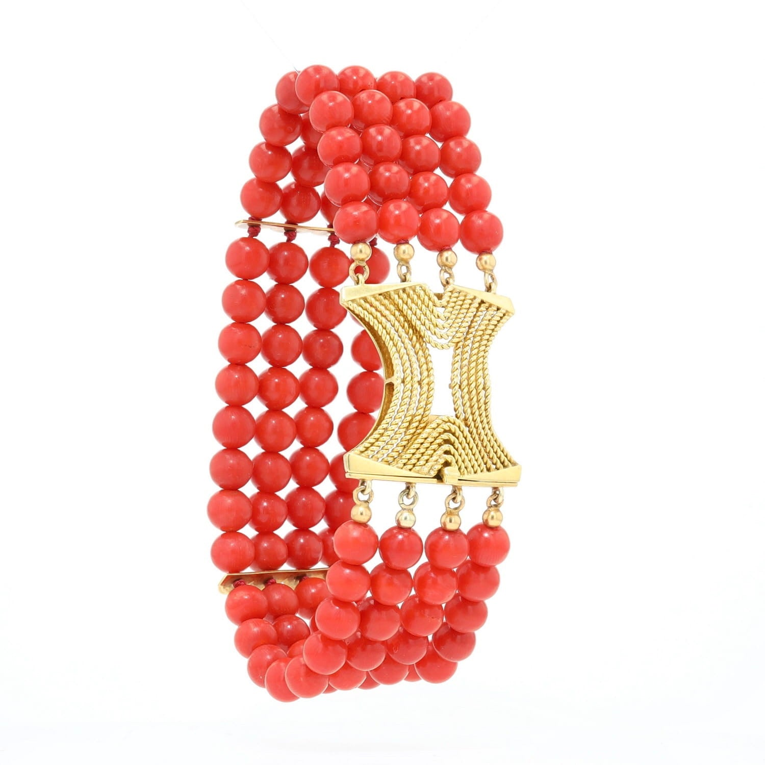 Four-row vintage red coral bracelet with a 750 yellow gold clasp, set up turned to the right